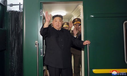 Kim Jong-un waves as he departs by train from Pyongyang for a visit to Russia