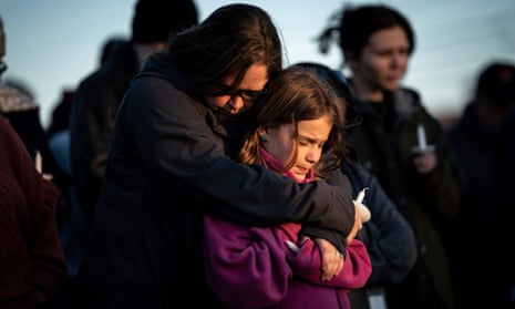 Sarah Tuck with her daughter, Emmalin Sweeney, 10, during a community vigil on 28 March 2023, in Mt Juliet, Tennessee.
