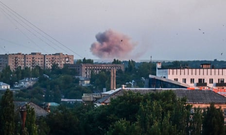 Smoke rises after shelling in Donetsk on 13 June.