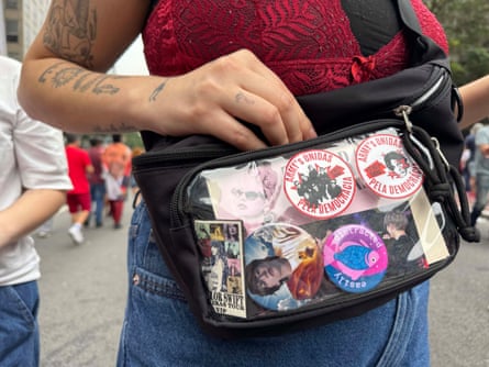 A fan with a bag featuring bespoke BTS stickers.