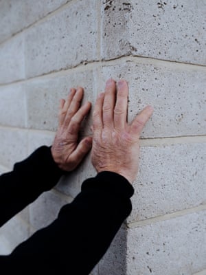 Builder Tony O’Connell, 53, inspects the masonry.