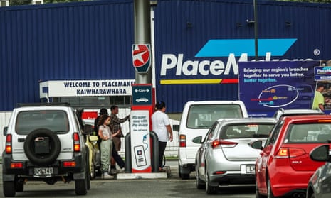People queue to buy petrol in Wellington, New Zealand, this year