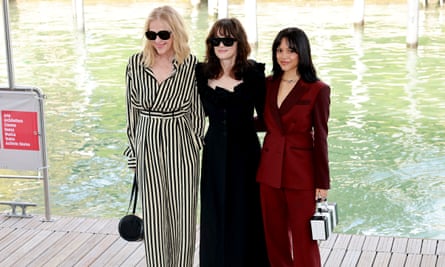 Catherine O’Hara, Winona Ryder, and Jenna Ortega pose next to the Venice canal