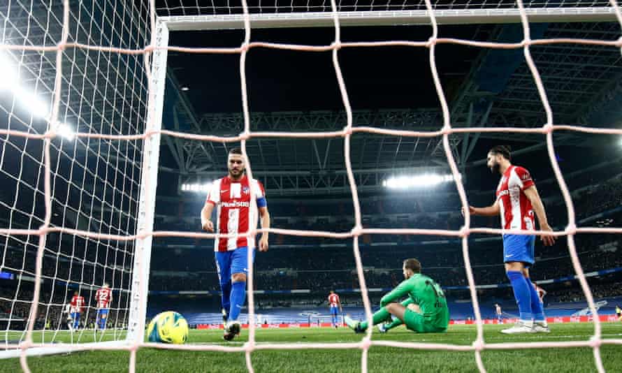 Atlético players look dejected after Marco Asensio’s goal