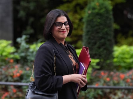 Shabana Mahmood walks in Downing Street with a red folder of documents under her arm.