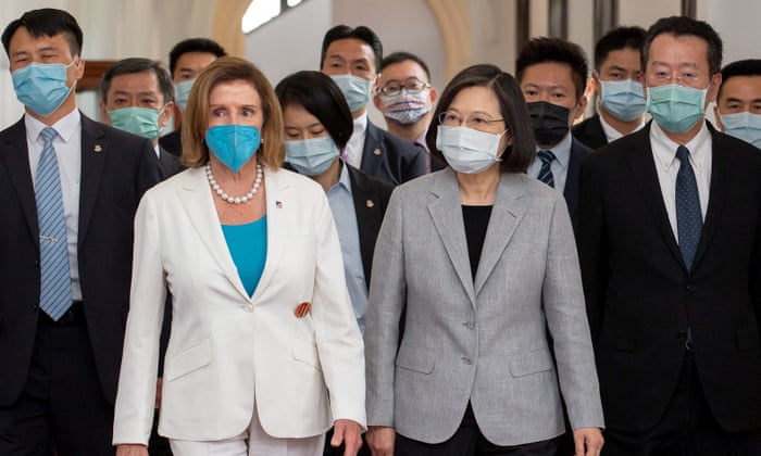Pelosi and Tsai walk at the presidential office in Taipei, Taiwan on Wednesday.