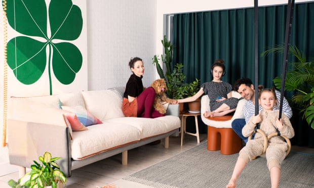 Designers Shay Alkalay and Yael Mer with their two children and cockapoo Ami.