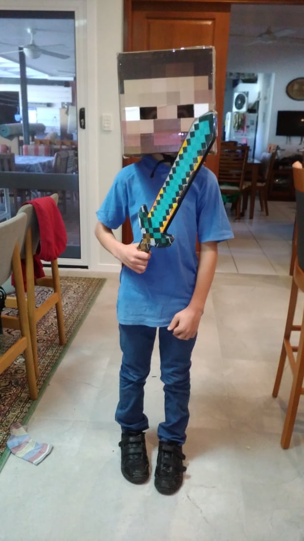 Warren Murray's son in a Minecraft-inspired cardboard outfit