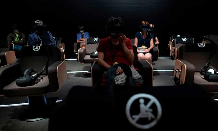 Journalists with 3D virtual reality headsets attend a presentation of Symphony: A Journey to the Heart of Music.