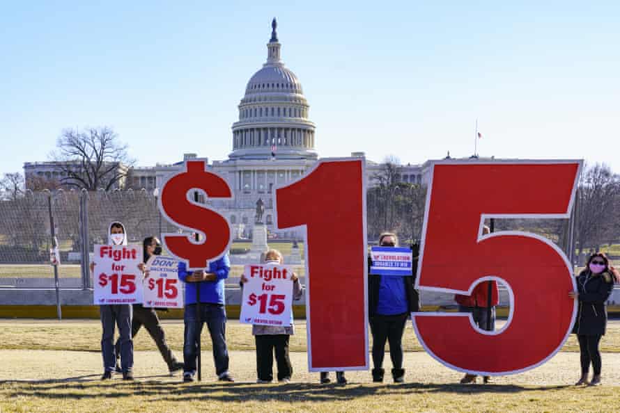 Activists show support for a $15 minimum wage near the Capitol in Washington DC on 25 February.