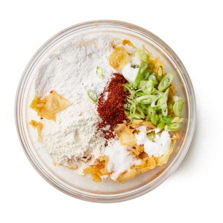 Add the spring onions, flours, baking powder, MSG, salt, sugar and chilli flakes, if using, then stir in the kimchi juice and the water, and mix briefly and only until you can see no more dry ingredients but no more or ; if you overmix, your pancake will be tough.