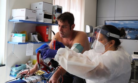 A recovered coronavirus patient has his heart and lung function measured as part of a rehabilitation process.