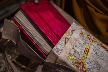 Closeup view of a manuscript with red leather cover