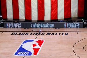 An empty court and bench are shown following the scheduled start time of game five of an NBA basketball first-round playoff series in Lake Buena Vista, Florida, on 26 August