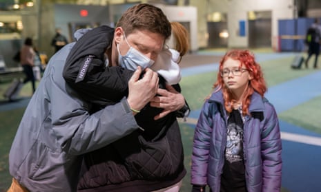  Sergey Korenev says goodbye to his two daughters, Maria and Anna, before traveling to Ukraine.