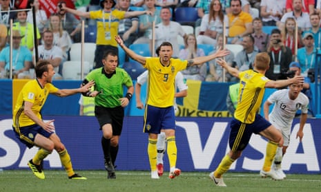 Sweden’s Marcus Berg and teammates appeal to referee Joel Aguilar after a challenge by South Korea’s Kim Min-woo in the penalty area.