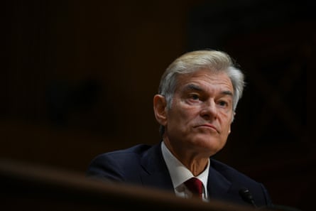 a man in a suit looks ahead