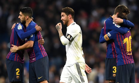Sergio Ramos walks past celebrating Barcelona players after Real Madrid’s second defeat to the Catalan side in a week. 