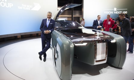 Rolls-Royce’s chief executive, Torsten Müller-Ötvös, poses next to the Vision Next 100.