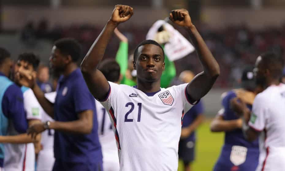 Tim Weah salutes the US fans after his team clinched their place at the Qatar World Cup