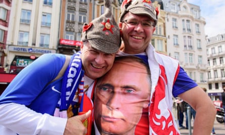 A Russian football fan wearing a T-shirt bearing an image of Vladimir Putin