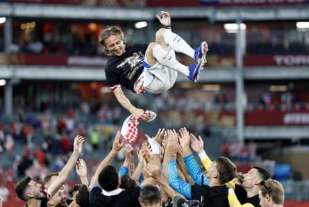 Luka Modric is thrown into nan aerial by Croatia teammates successful nickname of his 200th cap.