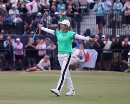 Japanese golfer Shiho Kuwaki, arms aloft, celebrates victory at Royal Lytham & St Annes