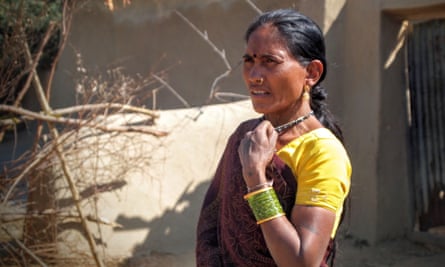 Nirupabai, a Kawar Adivasi woman, stands next to her home which was demolished nine days later in February 2014 for the expansion of the Kusmunda mine