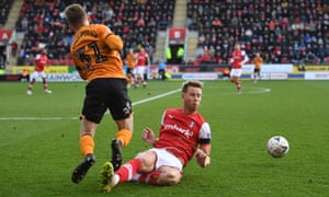 Keane Lewis-Potter of Hull City is tackled by Adam Thompson of Rotherham United resulting in a red card.