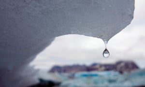 An iceberg melts in Kulusuk Bay, eastern Greenland