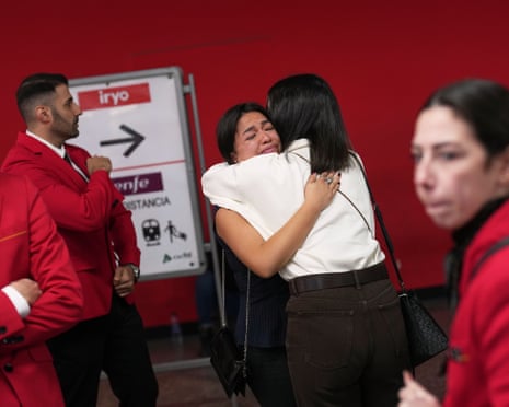 Railway staff after observing a minute of silence at Atocha station, Madrid