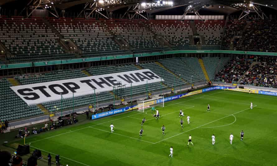 Action from Tuesday's game as the banner behind the goal calls for peace.