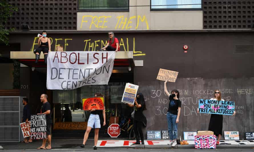 Demonstrators outside the hotel where Djokovic was being held