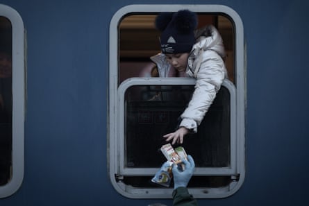 Refugee children fleeing Ukraine arrive at the train station in Zahony, Hungary.