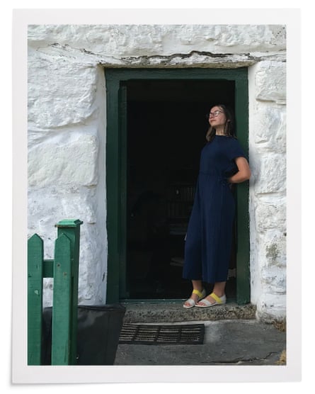 Martha Mills, standing in the doorway of their Welsh holiday cottage, the night before her bike accident, July 2021