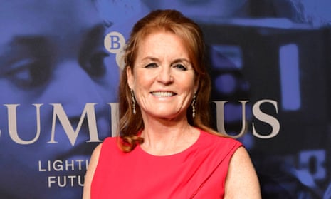 Sarah Ferguson in a red dress at a red-carpet photo call.