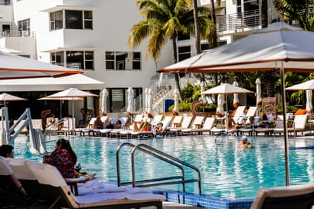 People lounging poolside