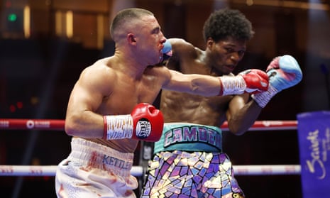 Nick Ball lands a left hand on Raymond Ford during their WBA featherweight title fight on Saturday night in Riyadh.