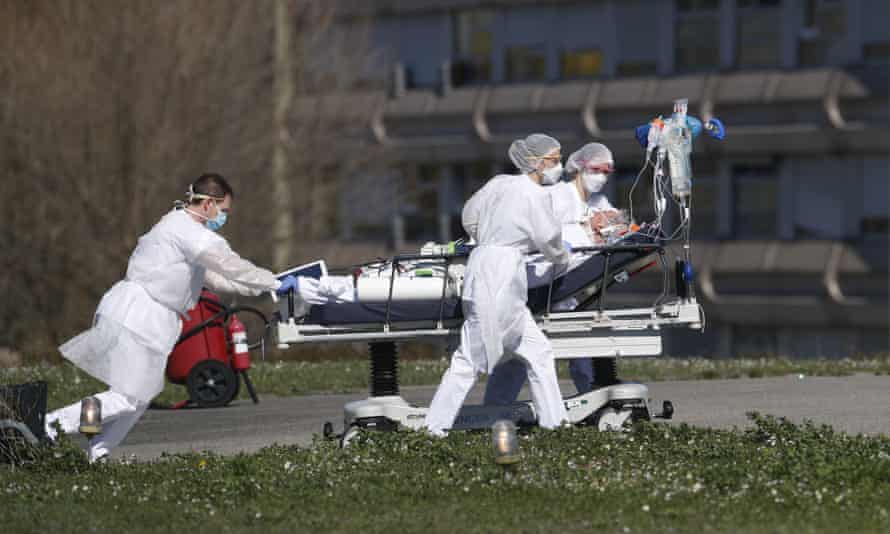 A Covid-19 patient being evacuated from a hospital in France in March last year.