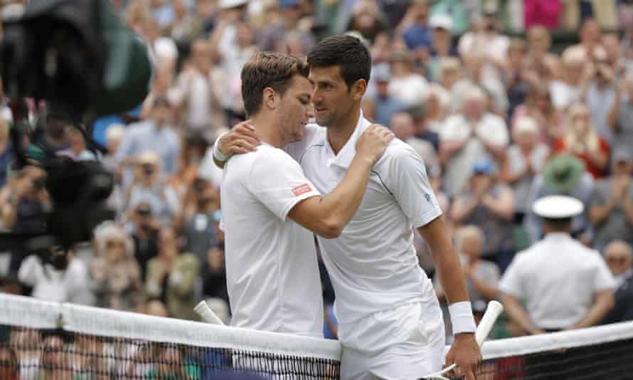 Novak Djokovic hugs Miomir Kecmanovic after winning Wimbledon in the third round