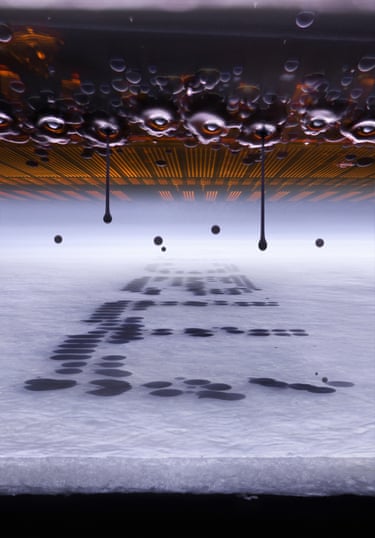 Microscopic view of an inkjet printer depositing ink on to paper