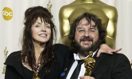 Peter Jackson and Fran Walsh hold their Oscar statues after The Lord of the Rings: The Return of the King won best motion picture in 2004.