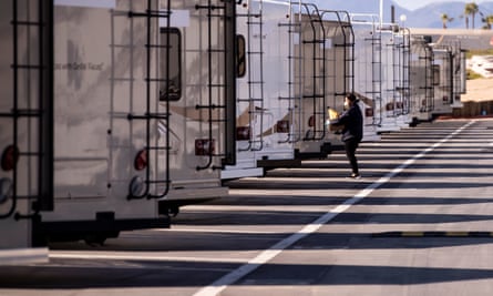 An LA county health department employee prepares trailers amid the coronavirus pandemic.