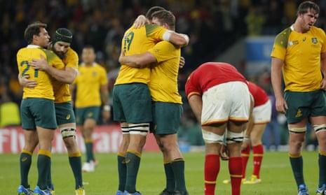 Australian players celebrate their victory after the final whistle.