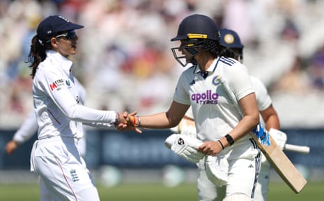 Yastika Bhatia is congratulated by Maia Bouchier of England after being dismissed after being the first batter to make a century in a test match at Lords.