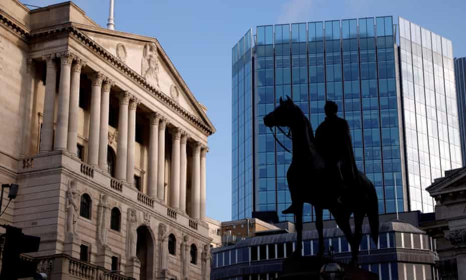 The Bank of England and other City buildings, with a silhouetted statue of a man on a horse in the foreground