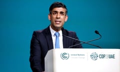 Rishi Sunak delivers a speech at a podium at the Cop28 summit in Dubai.