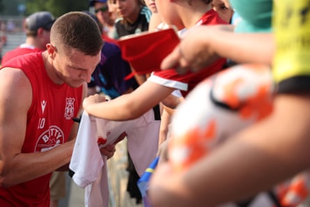 Wrexham’s Paul Mullin signs autographs for fans in the US