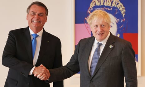 Jair Bolsonaro and Boris Johnson shake hands