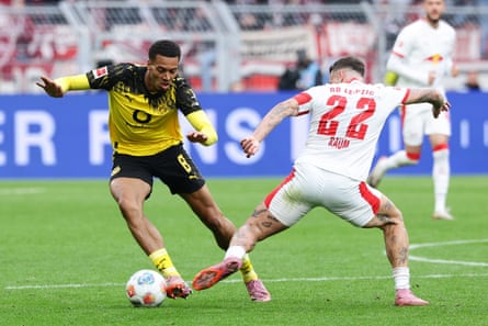 Felix Nmecha and David Raum battle it out during the 1-1 draw in Dortmund.